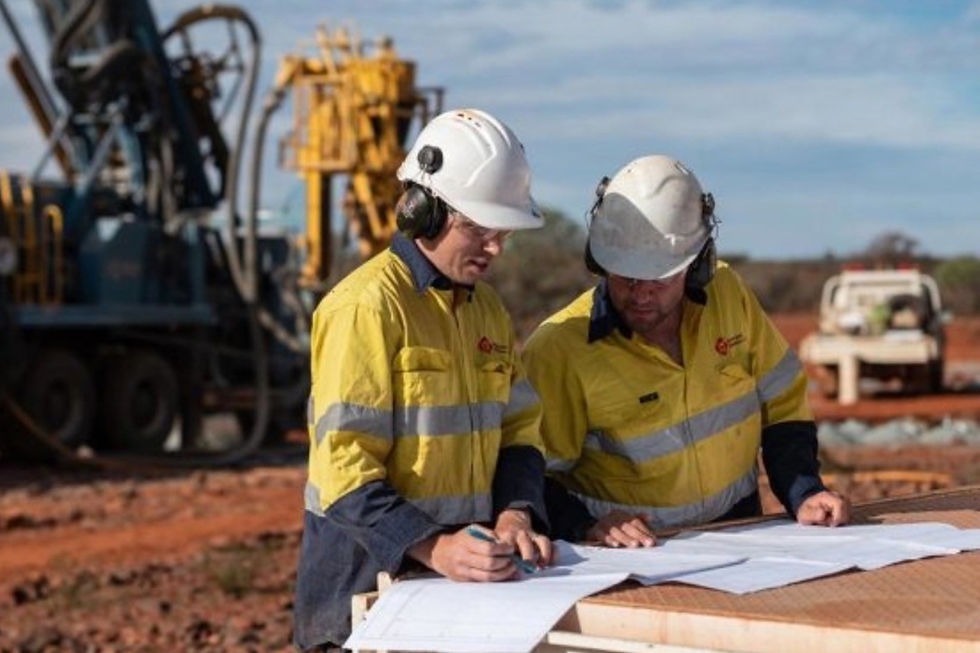 Drill operators look over drilling plans at Gateway Mining’s Yandal gold project in Western Australia. Credit: File