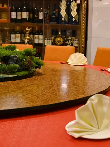 Round private dining table set for a group meal at Go Sing