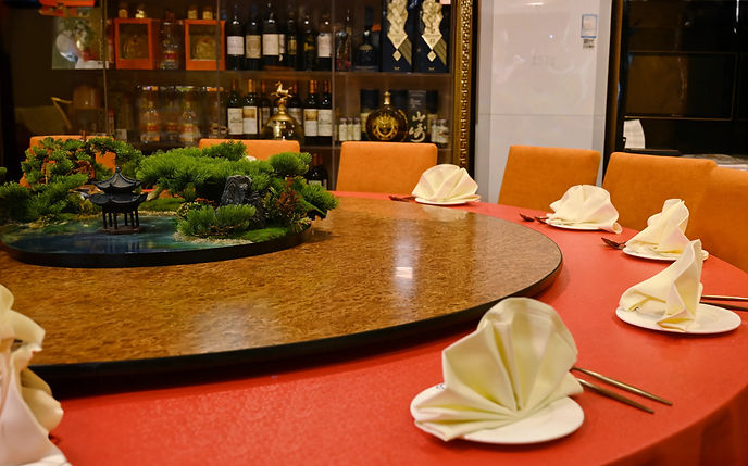 Private dining table at Go Sing with a miniature Chinese garden centerpiece
