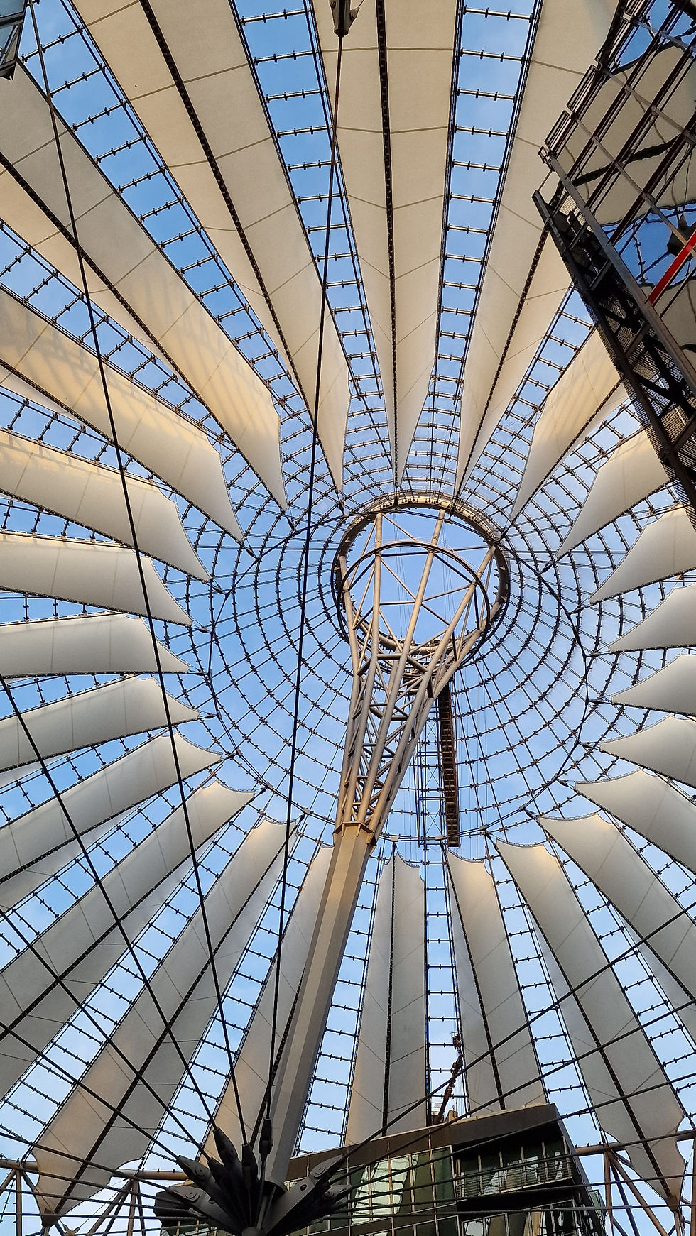 The striking, translucent roof of Potsdamer Platz looks like an oversized aircraft turbine.