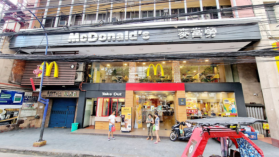 A branch of the fast food chain McDonald's photographed from the outside.