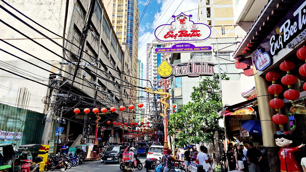 A shopping street in Chinatown decorated with red lanterns.