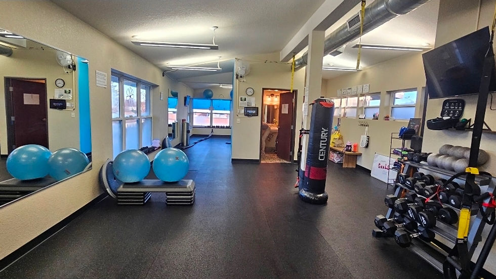 Close-up view of a kettlebell and resistance bands on a wooden floor