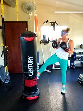 Sandi kicking bag_edited_edited.jpg
