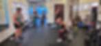 Eye-level view of a small group training session in a modern fitness studio