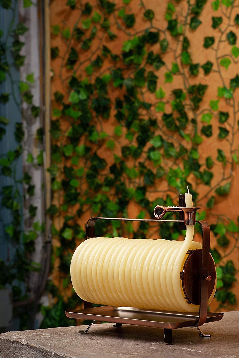 rustic metal stand with long coiled candle decorative candles structural sculptural architechtural
