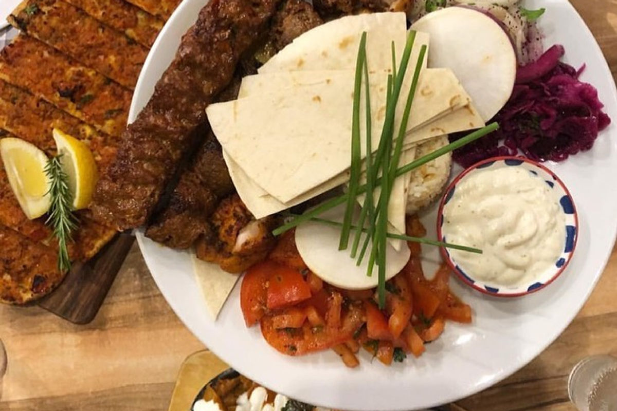 Sahara charcoal grill platter with Adana, shish, bread, salads and dips