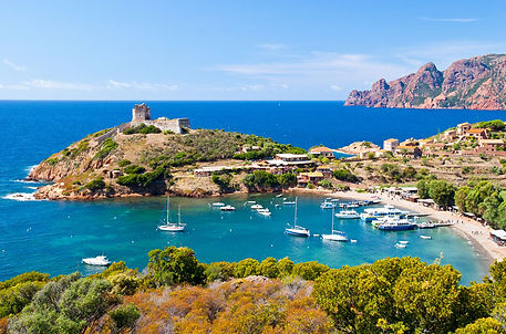 7. Luxury Yachts, Bareboat sailing yachts and catamarans anchored near Girolata, Corsica.