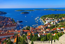 Hvar town and harbour with Pakleni islands — luxury yacht charter Croatia Adriatic.