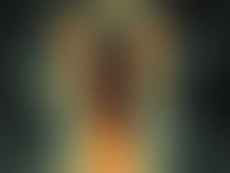 A skeletal figure with a flaming robe and golden wings hovers in a smoky, mystical setting. A clock-like halo is visible in the background.