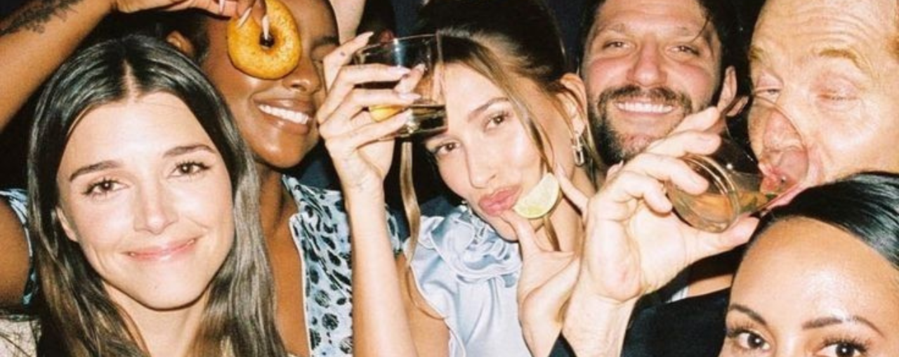 People laughing over food at Bangkok travel meetup