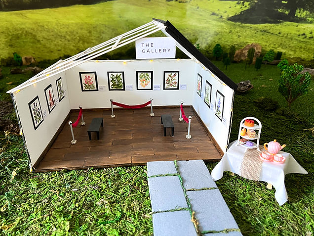diorama of miniature art gallery w/ mini wall art
