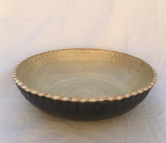 Large stoneware serving bowl, with textured edge. Glazed in matt black on the outside, and shino inside.7