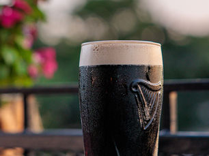 Guinness pint on the rooftop patio at Dublin Pub in the Oregon District downtown Dayton Ohio at sunset