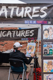 Caricature artist at work at the Sugar Maple Festival Bellbrook Ohio