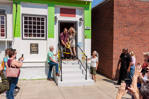 Community members celebrating the ribbon cutting at Golden Goods Thrift and Repair Yellow Springs Ohio