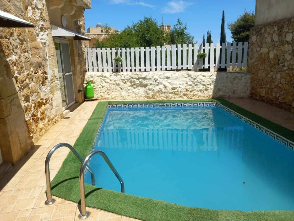Discover a beautifully restored 2-bedroom farmhouse on the peaceful outskirts of Xaghra, Gozo. This charming property features a private pool, stunning country views, and authentic Gozitan character. Perfect for families and pet owners, the farmhouse offers pet-friendly amenities and a tranquil setting for a relaxing getaway. Enjoy traditional stone architecture, modern comforts, and easy access to Xaghra’s attractions. Book your stay at this unique Gozo farmhouse and experience the perfect blend of rustic charm and contemporary convenience in one of Malta’s most picturesque locations.