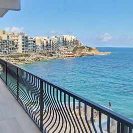 Discover refined coastal living in this impeccably finished two-bedroom apartment, set on the coveted seafront of Marsalforn, Gozo. Floor-to-ceiling glass doors flood the open-plan living space with natural light, seamlessly connecting to a private balcony that frames sweeping Mediterranean vistas. The sleek, contemporary kitchen is equipped with premium appliances, including a dishwasher, while both bedrooms offer tranquil retreats with air conditioning for year-round comfort. Elegant modern finishes, lift access, and effortless proximity to vibrant cafés, boutique shops, and the picturesque promenade ensure a lifestyle of sophistication and convenience. Perfectly positioned to capture the essence of Gozo’s most sought-after coastal enclave, this residence is an exceptional retreat for those seeking luxury, serenity, and the timeless allure of waterfront living.