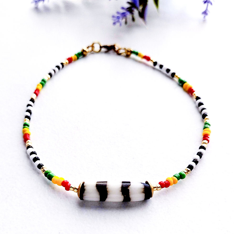 Handmade Culture Stripes anklet with African batik tube beads colorful seed beads and gold accents.
