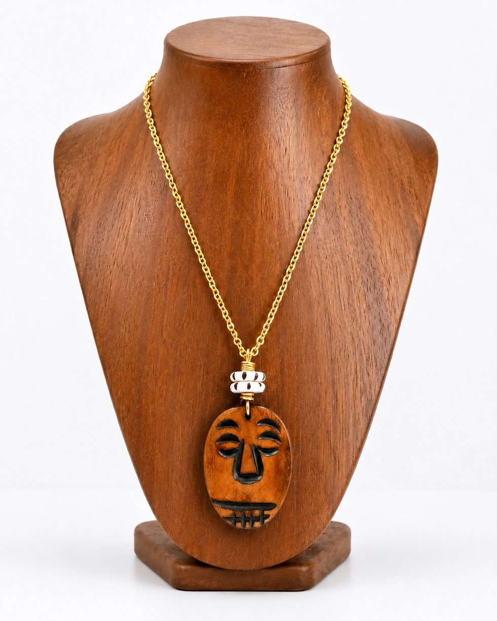 Echo of the Ancestors necklace with a brown African mask pendant and African batik beads.