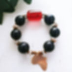 Thumbnail: Bakari African amber bracelet with black wood beads, batik bead, brass accents, and Africa charm