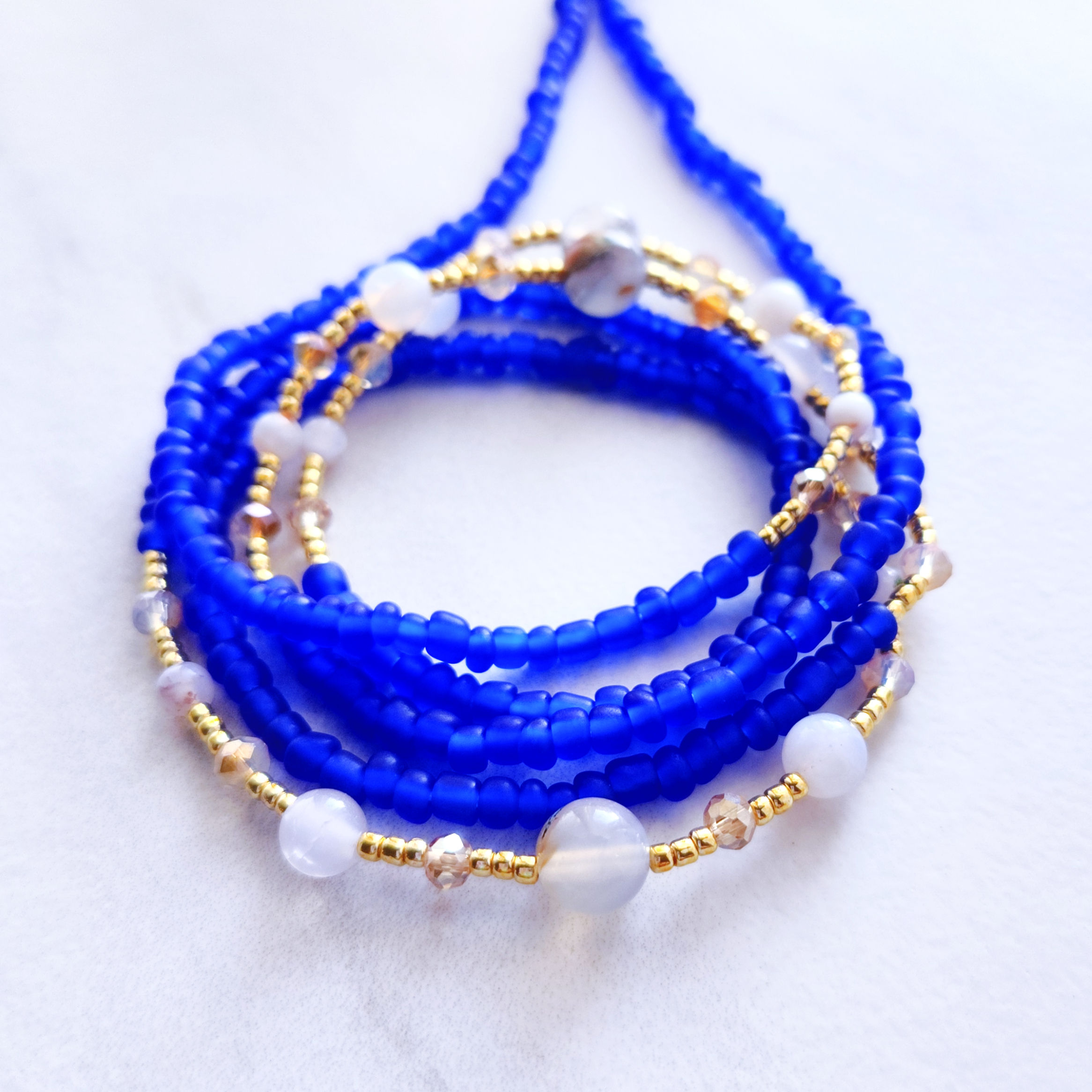 agate tie on waist beads with matte blue glass beads crystal accents and gold details