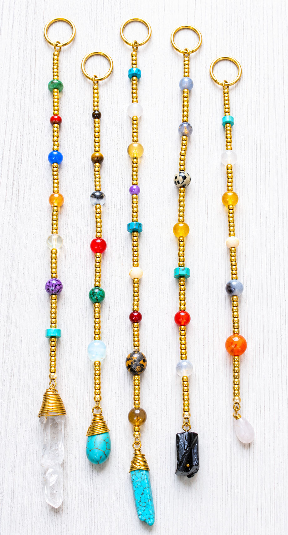 Thumbnail: Handmade Gold & Treasure long loc beads featuring mixed natural stone beads and gold accents.