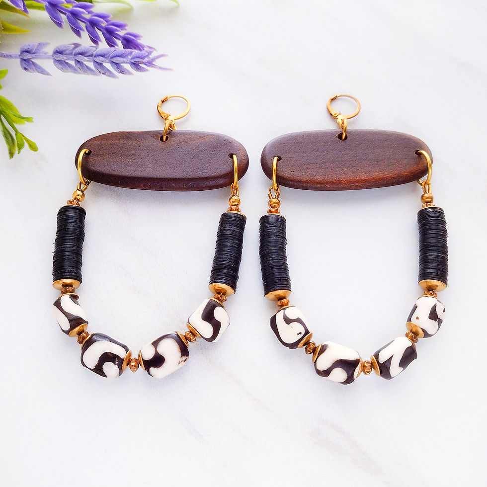 Thumbnail: African beaded earrings with wooden pendants, black beads, batik beads, and brass accents