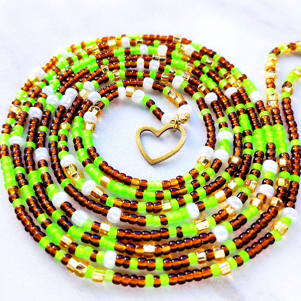 Thumbnail: Green, white, brown. and gold waist beads with a brass heart charm arranged in a circular shape