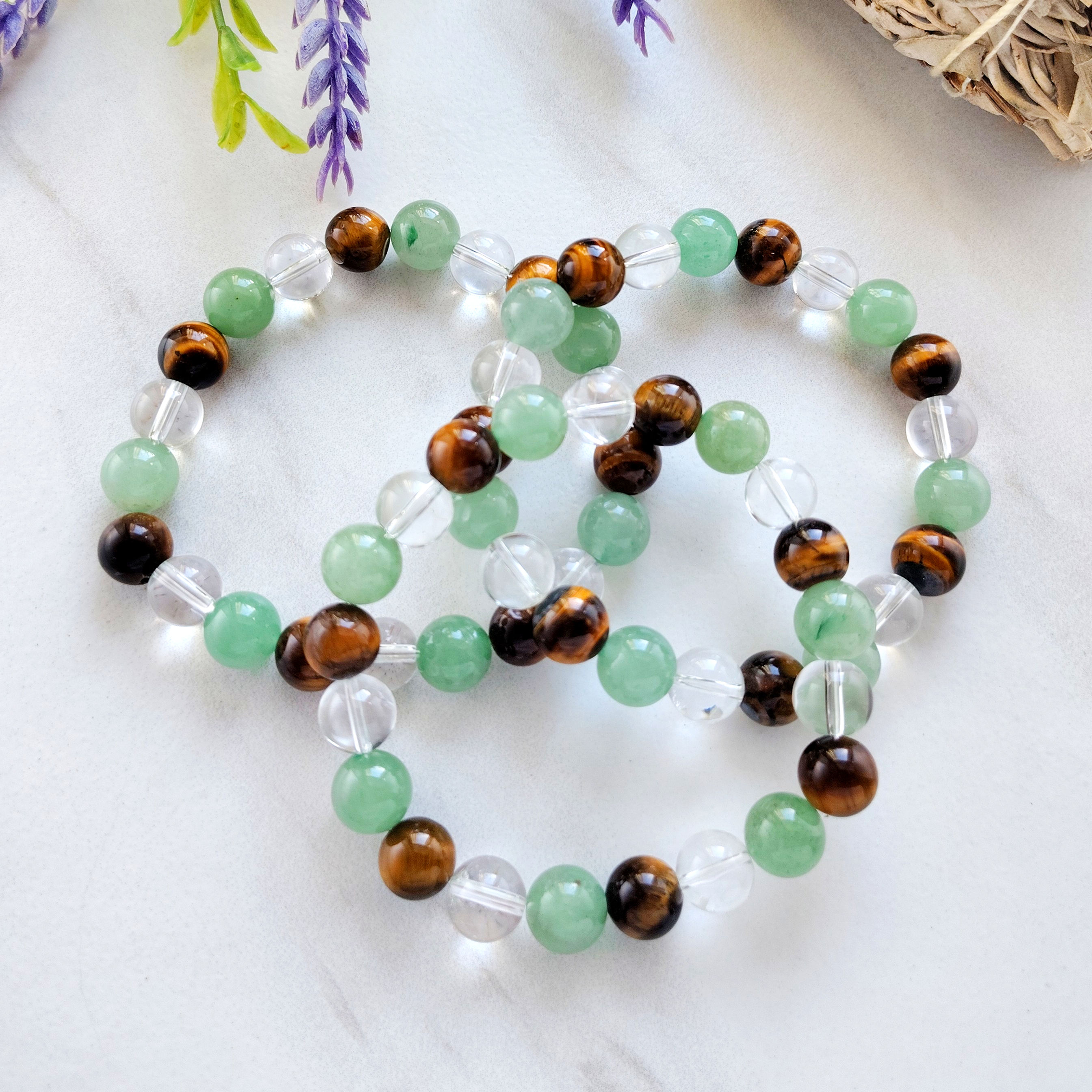 Green aventurine, clear quartz, and tiger’s eye beaded alignment bracelets