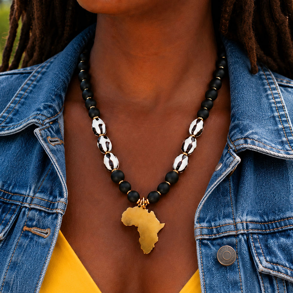 Handcrafted Beautiful & Black necklace featuring African batik beads, a brass Africa pendant, and matte black glass beads.