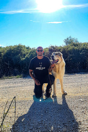 Tiago Rosado with one of his dogs from Mundo Alão