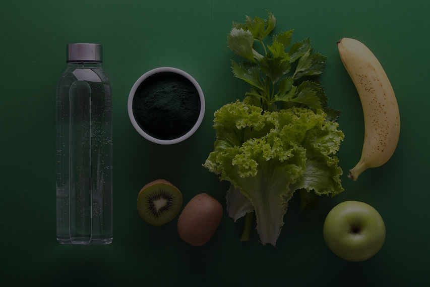 Background image of fruits and vegetables laid out on a green background