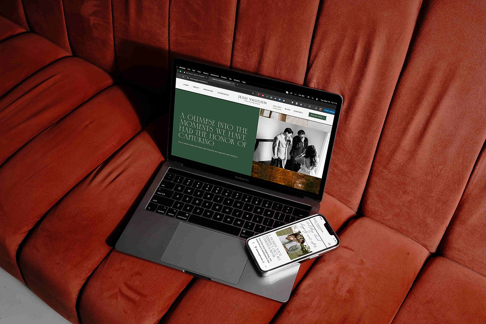 A laptop and smartphone display the website for Jessi Vaughn Photography, featuring wedding imagery. The devices are placed on a textured rust-colored surface.