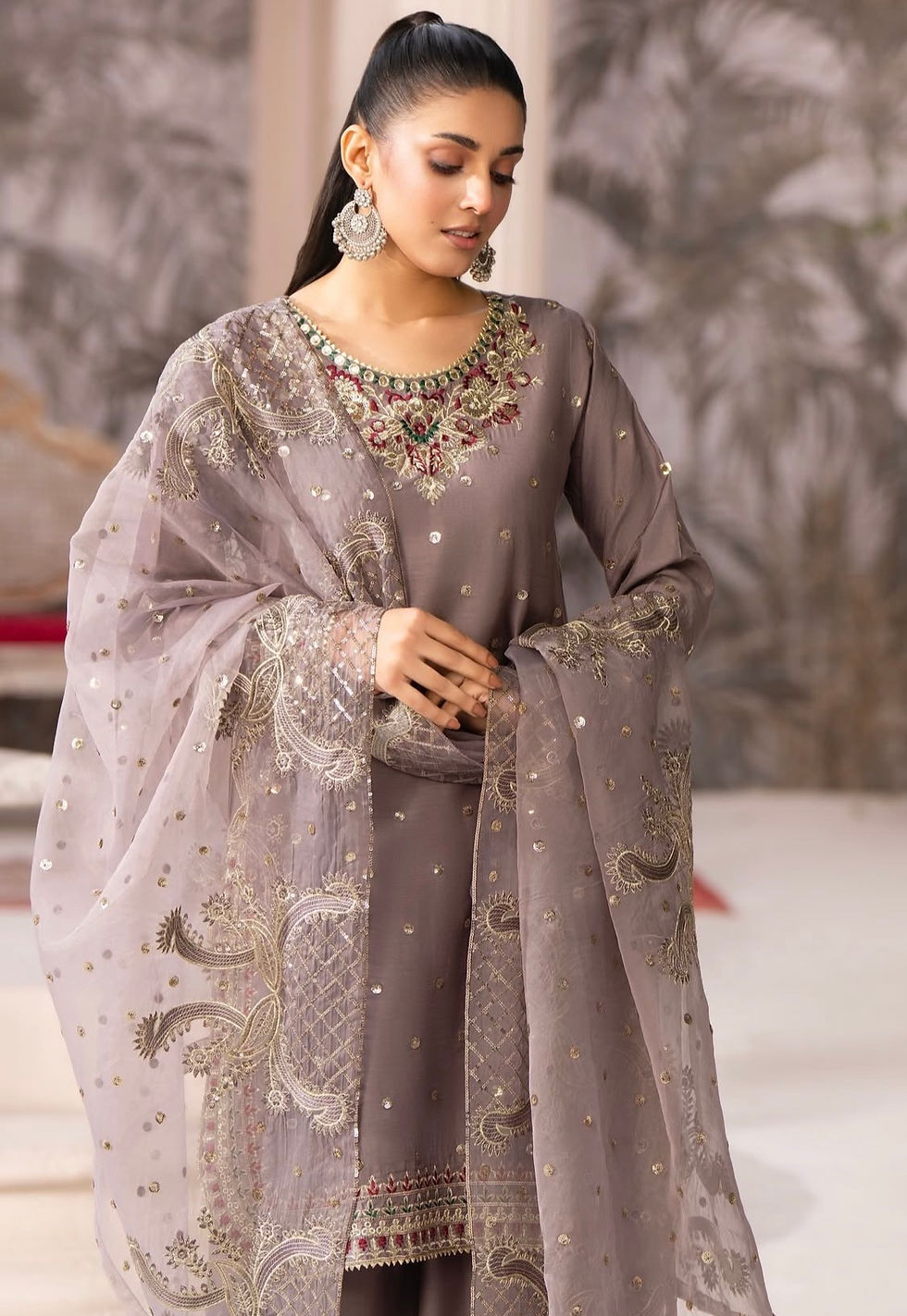 Close-up view of embroidered fabric on a ready-to-wear Pakistani suit