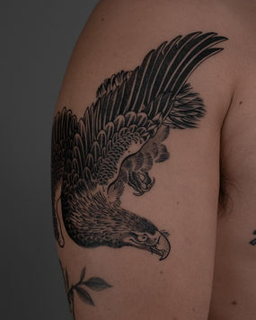 Japanese hawk tattoo inspired by traditional Japanese print on shoulder in black and grey, custom tattoo Boston