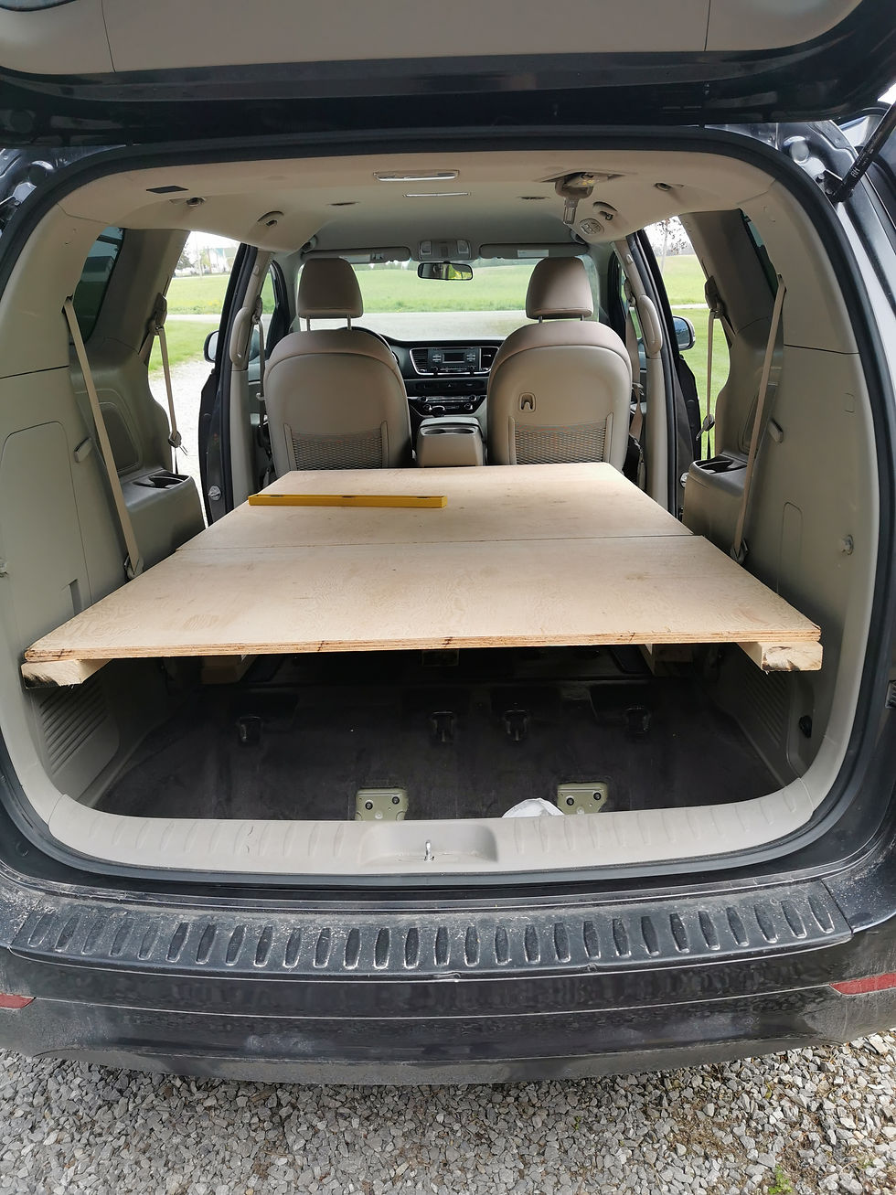 The bed platform is made. A piano hinge connects the two pieces so we can lift up the back section to access our "kitchen."