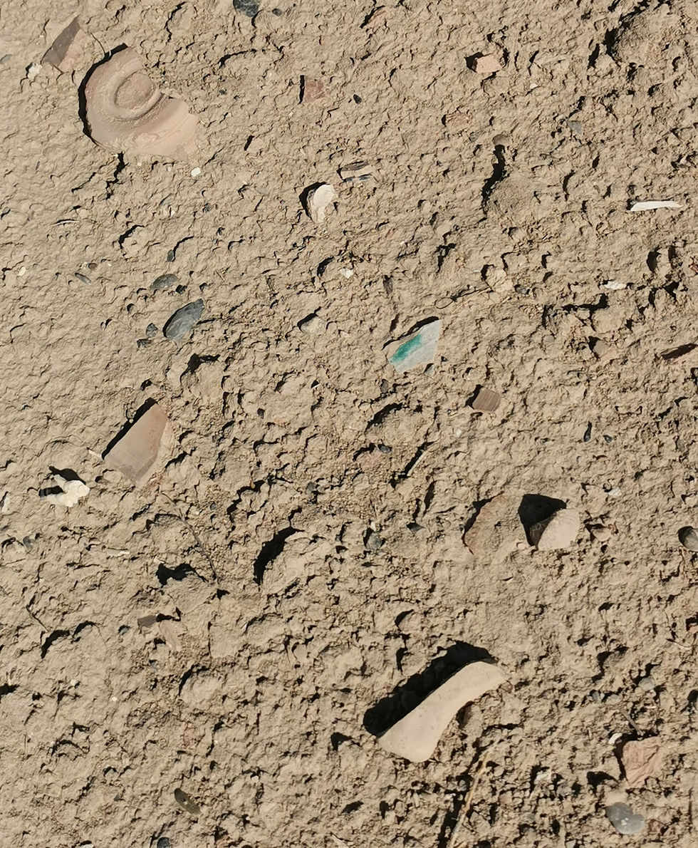 Pottery fragments are scattered everywhere. 
