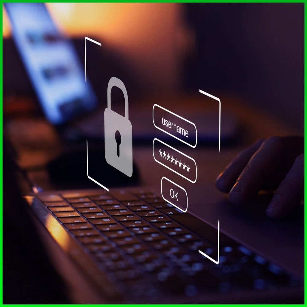 User typing in password on laptop