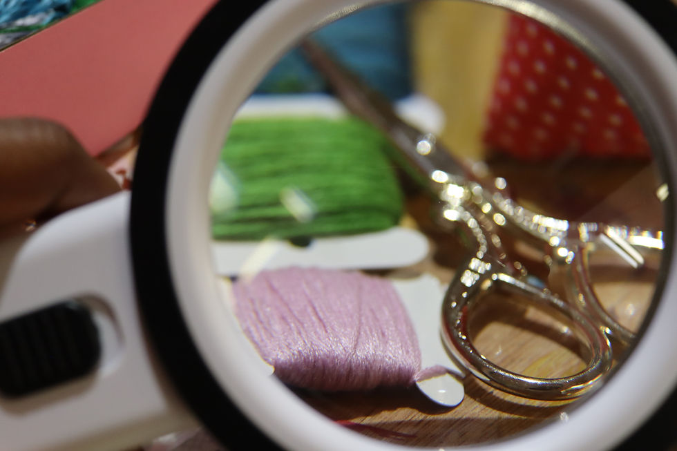 Thumbnail: Magnifying glass, thread and embroidery scissors