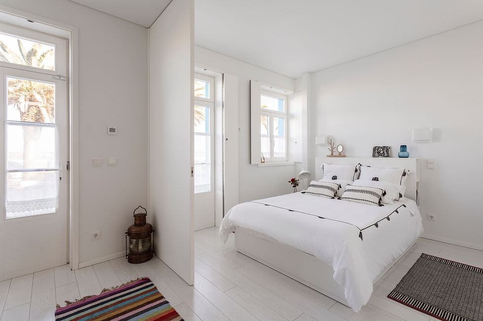 Bright bedroom with double bed at M Costa Nova