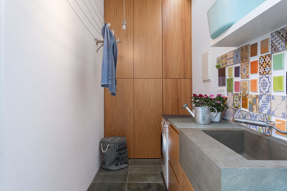 Equipped laundry area for extended stays at M Costa Nova