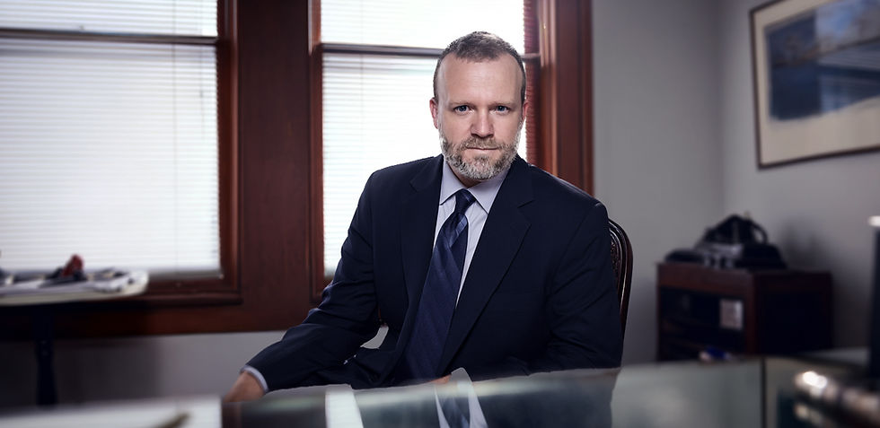 Portrait of Attorney Keith F. Diaz of Apis Law sitting at a desk.. 20+ years of personal injury experience and knowledge of NH Statute of Limitations