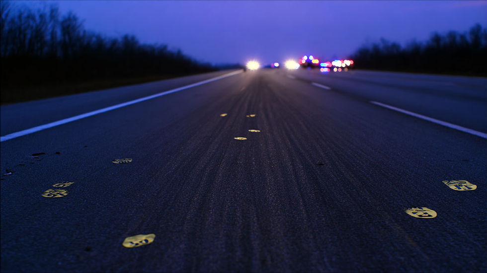 truck-accident_dusk-lit_roadway_with_long_skid_marks_and_numbers_apis-law-personal-injury.