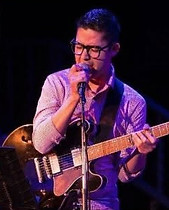 Johnny Vadles with Guitar.jpg