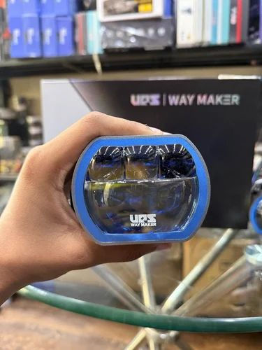 Hand holding a UPS Waymaker LS-850 LED projector lens