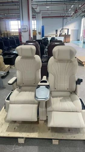 Beige recliner set's defender seats in a showroom warehouse