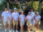A group photo of a team in summer uniforms