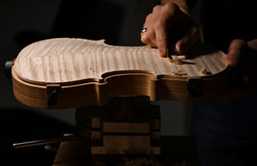 Shaping a violin back with a thumb plane