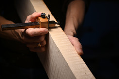 Marking the thickness before sawing the cello ribs